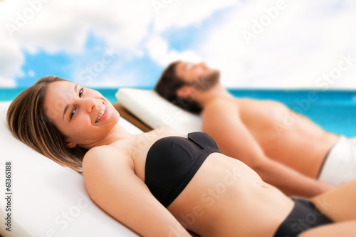 Photo: Couple on a sunny beach Couple on a sunny beach