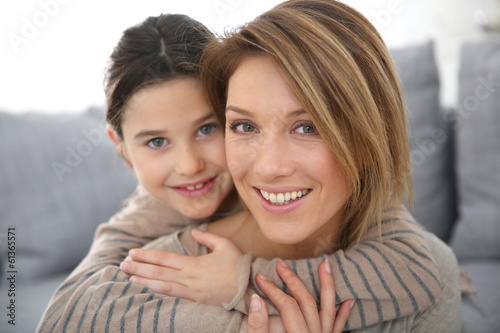 Photo: Mother with daughter relaxing at home Mother with daughter relaxing at home