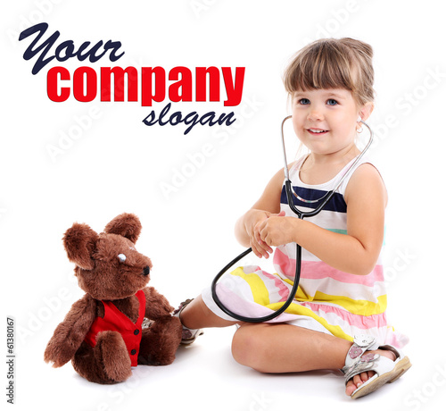 Photo: Little cute girl playing doctor, isolated on white Little cute girl playing doctor, isolated on white