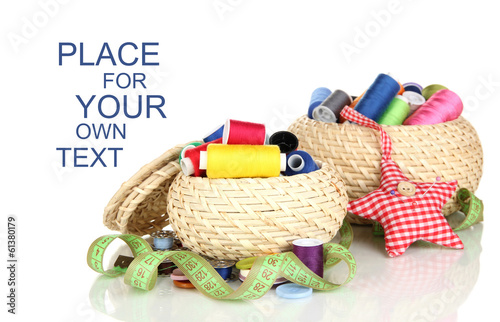 Photo: Wicker baskets with accessories for needlework isolated on Wicker baskets with accessories for needlework isolated on