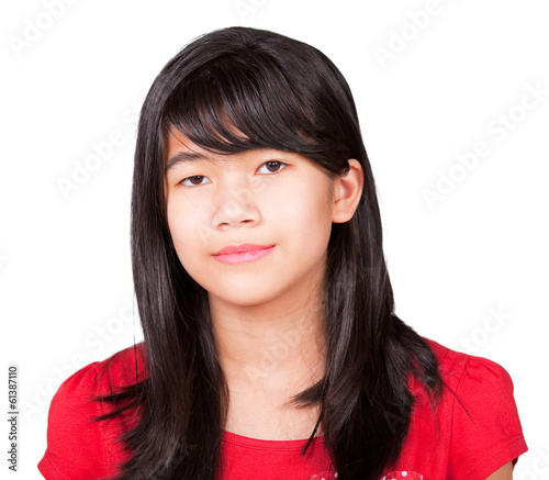 Photo: Preteen biracial girl in red shirt on white background Preteen biracial girl in red shirt on white background