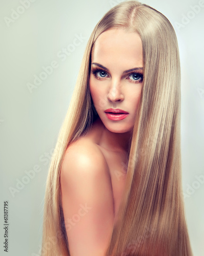 Photo: Beautiful blonde woman with long, healthy and shiny hair. Beautiful blonde woman with long, healthy and shiny hair.