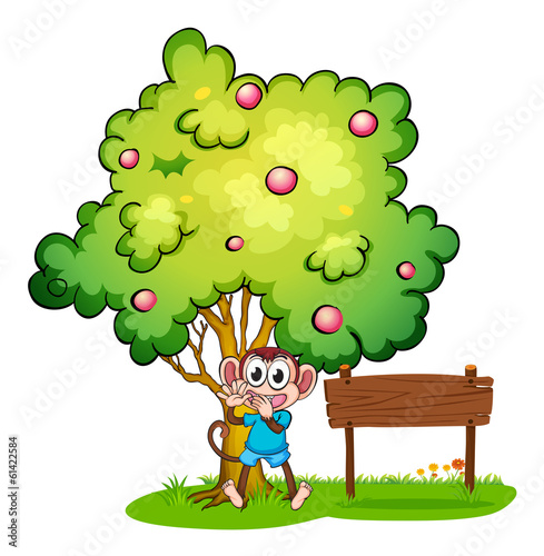 Vector: An empty signboard beside the monkey under the tree An empty signboard beside the monkey under the tree