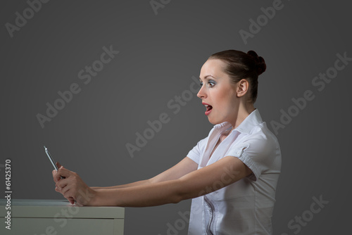 Photo: business woman holding a tablet computer business woman holding a tablet computer