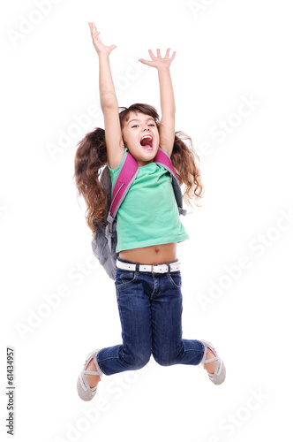 Photo: Happy schoolgirl jumping high on white background Happy schoolgirl jumping high on white background
