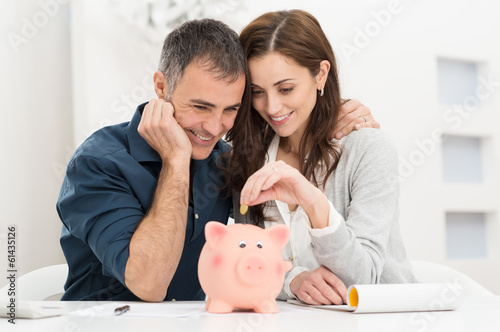 Photo: Couple Saving Money Couple Saving Money