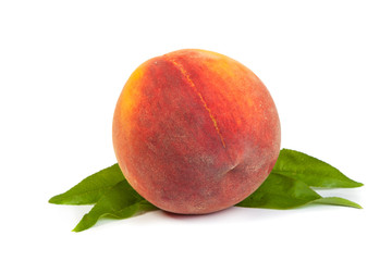 Three perfect, ripe peaches with a half  and slices isolated on