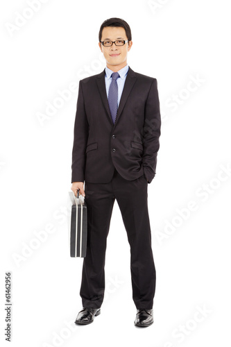 Photo: success businessman holding briefcase over white background success businessman holding briefcase over white background