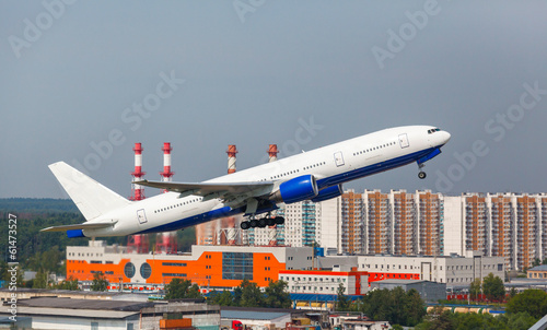 white plane takes off from the runway