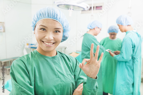 Photo: surgeons finish the operation and thumb up surgeons finish the operation and thumb up