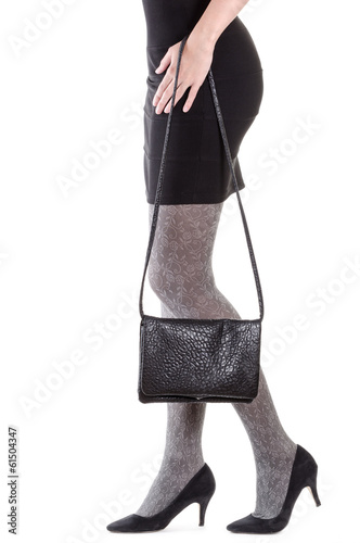 Photo: Woman legs with bag Woman legs with bag