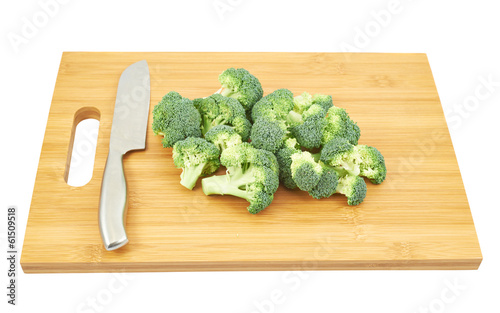 Photo: broccoli pieces over a cutting board broccoli pieces over a cutting board