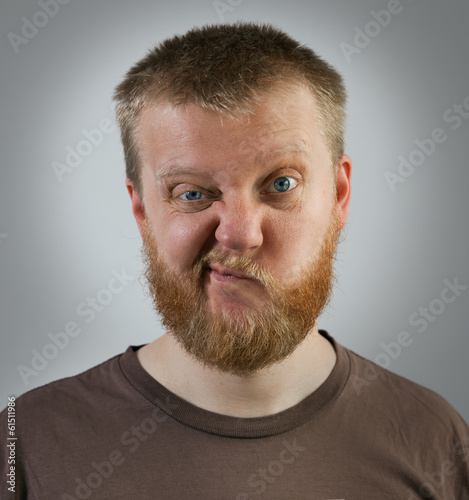 Photo: Man with an expression of discontent on his face Man with an expression of discontent on his face