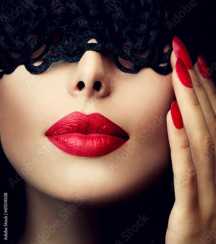 Beautiful Woman with Black Lace Mask over her Eyes