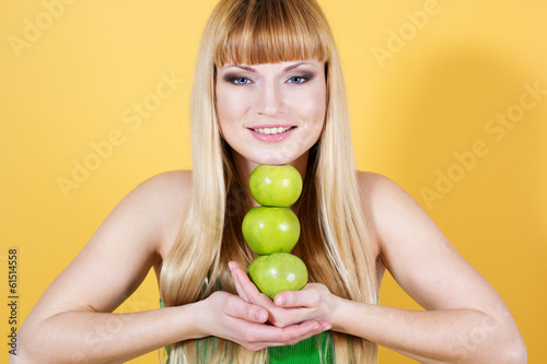 Photo: pretty girl with green apples pretty girl with green apples