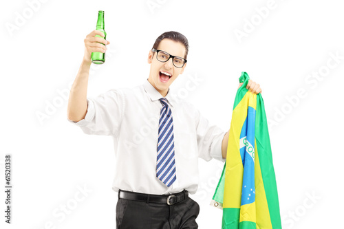 Photo: Excited male with beer bottle and brazilian flag Excited male with beer bottle and brazilian flag