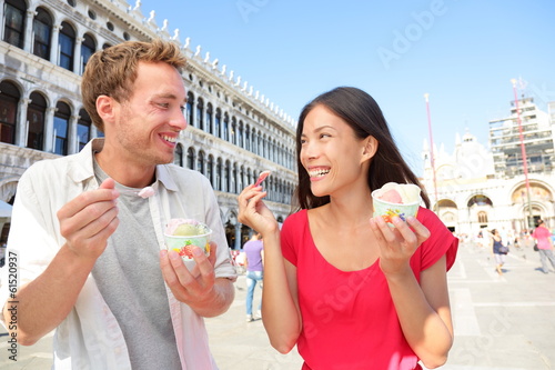 Photo: Couple eating ice cream on vacation, Venice, Italy Couple eating ice cream on vacation, Venice, Italy