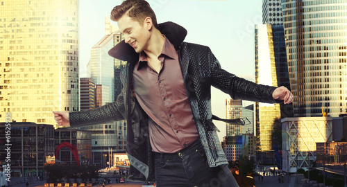 Photo: Shot of young man in the heart of the city Shot of young man in the heart of the city