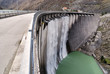 Water falls from the wall of the dam Water falls from the wall of the dam