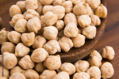 Photo: dried white chickpeas ceci on the wooden spoon dried white chickpeas ceci on the wooden spoon