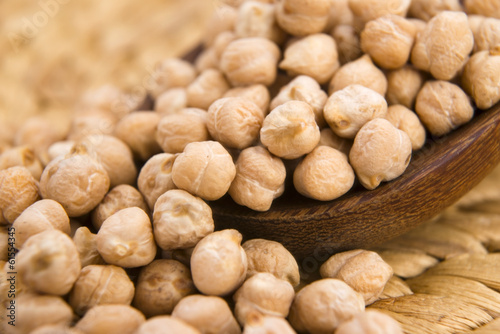 Photo: dried white chickpeas ceci on the wooden spoon dried white chickpeas ceci on the wooden spoon