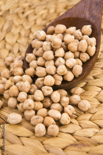Photo: dried white chickpeas ceci on the wooden spoon dried white chickpeas ceci on the wooden spoon