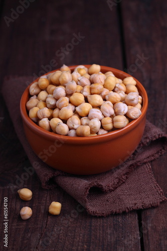 Photo: dry chickpeas in a bowl on the table dry chickpeas in a bowl on the table