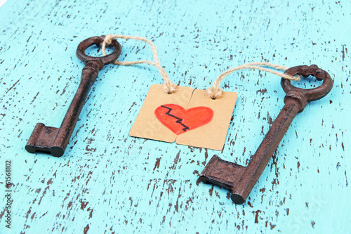 Photo: Keys to heart, Conceptual photo. On color wooden background Keys to heart, Conceptual photo. On color wooden background