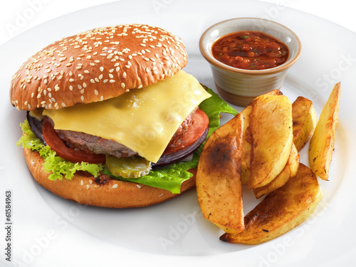 Photo: Fresh tasty hamburger with fried potatoes and salsa dip on a rou Fresh tasty hamburger with fried potatoes and salsa dip on a rou