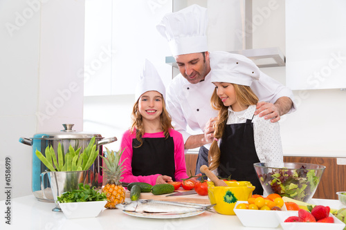 Photo: Chef master and junior pupil kid girls at cooking school Chef master and junior pupil kid girls at cooking school