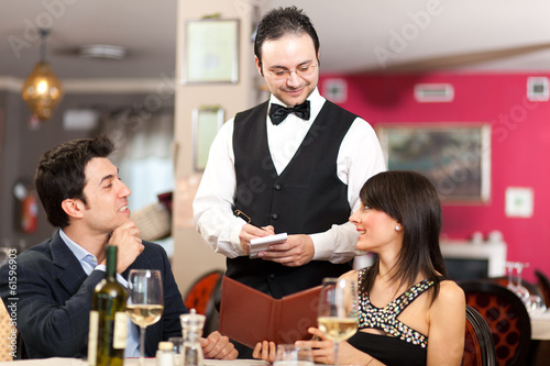 Photo: Couple having a dinner Couple having a dinner