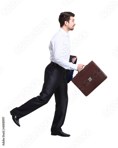 Photo: Profile of walking with case businessman Profile of walking with case businessman
