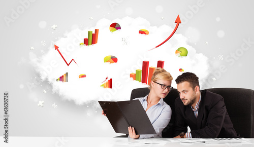 Photo: Businessman and businesswoman with cloud in the background conta Businessman and businesswoman with cloud in the background conta