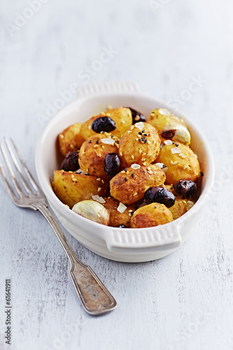 Photo: Oven-Baked Potatoes with Kalamata Olives, Turmeric and Sesame Se Oven-Baked Potatoes with Kalamata Olives, Turmeric and Sesame Se