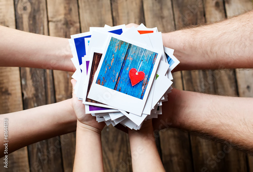 Photo: Set of images in family hands Set of images in family hands
