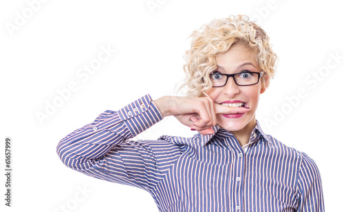 Photo: Funny businesswoman biting her finger Funny businesswoman biting her finger