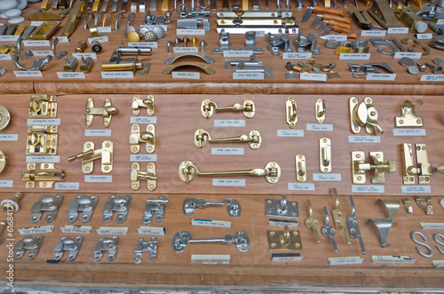 many type of cabin hook and other doors furniture in the showcase of a ironmonger shop in Soho, London