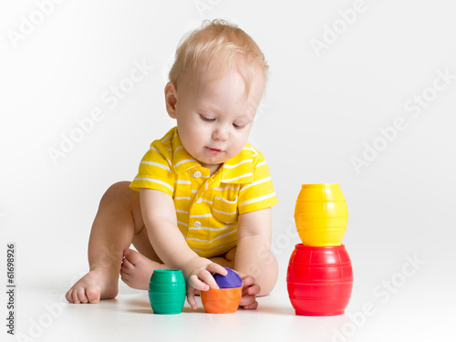 Photo: child boy playing with toys child boy playing with toys