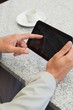 Businessman using a small tablet at table Businessman using a small tablet at table