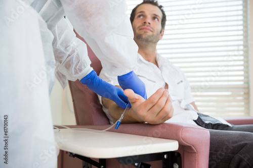 Photo: Patient Looking At Nurse While Receiving Intravenous Treatment I Patient Looking At Nurse While Receiving Intravenous Treatment I