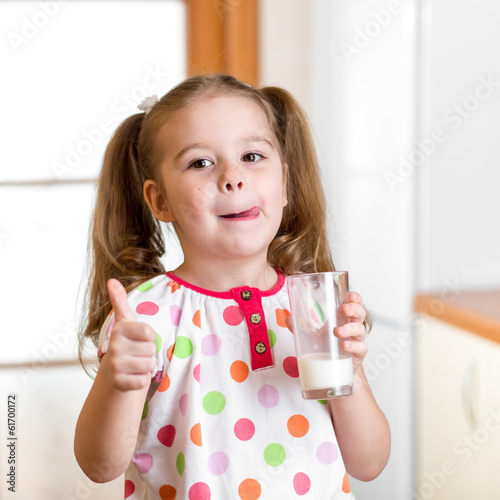 Photo: Kid drinking milk from glass Kid drinking milk from glass