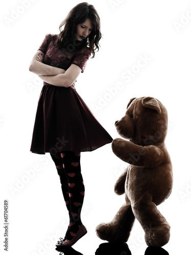 Photo: strange young woman and vicious teddy bear silhouette strange young woman and vicious teddy bear silhouette