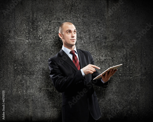 Photo: Man with tablet pc Man with tablet pc