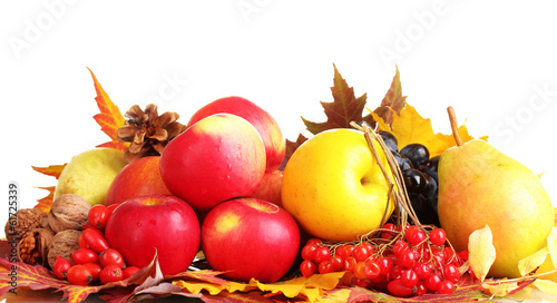 Photo: beautiful autumn harvest and leaves isolated on white beautiful autumn harvest and leaves isolated on white