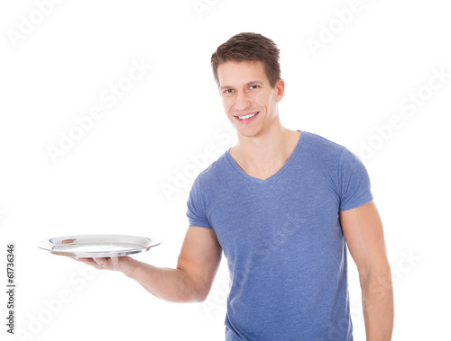 Photo: Happy Young Man Holding Empty Plate Happy Young Man Holding Empty Plate