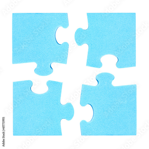 Photo: Four puzzle pieces combined cooperation concept Four puzzle pieces combined cooperation concept