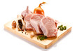 Raw pork on cutting board and vegetables Raw pork on cutting board and vegetables