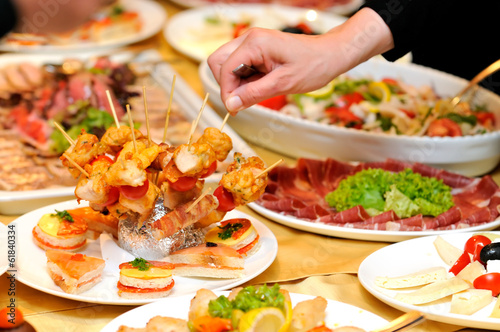 Photo: Human taking food on the party Human taking food on the party