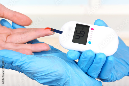 Photo: Measuring glucose level blood in hospital close-up Measuring glucose level blood in hospital close-up