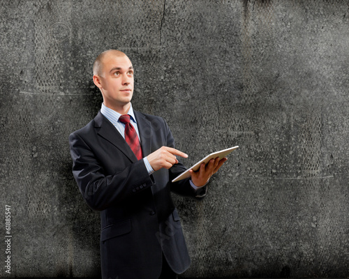 Photo: Man with tablet pc Man with tablet pc